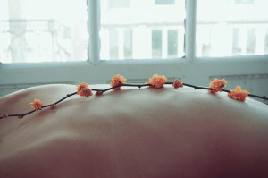 Canva - Orange Petaled Flowers on Person's Back